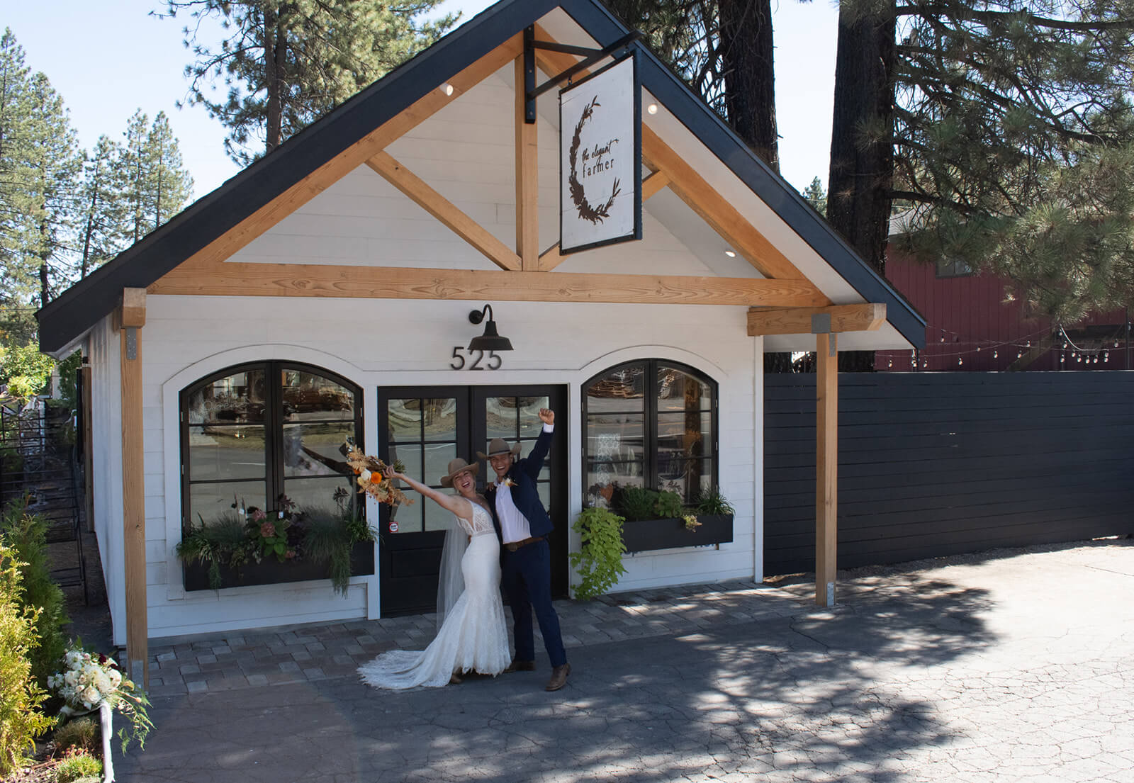 Wedding couple in front of the Elegant Farmer