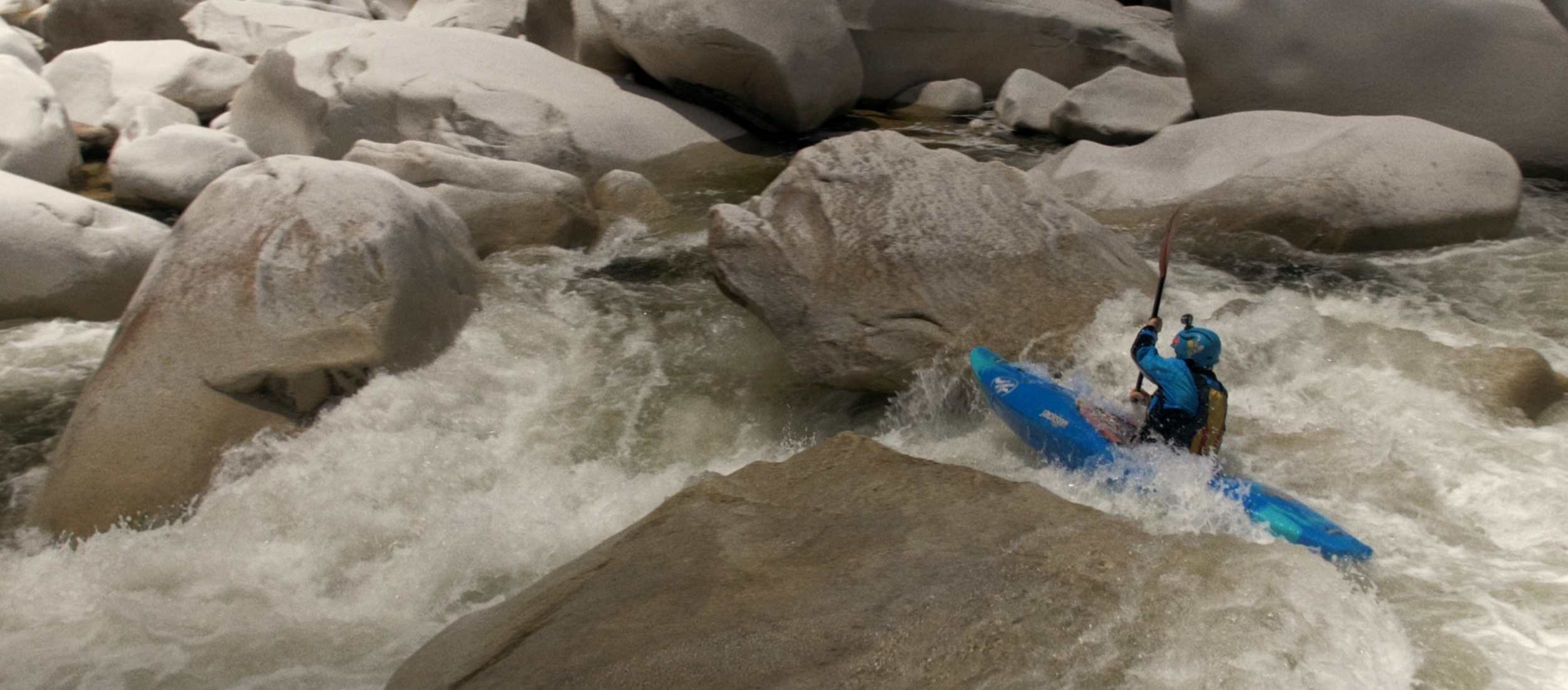 kayaker going through whitewater on middle fork of feather river