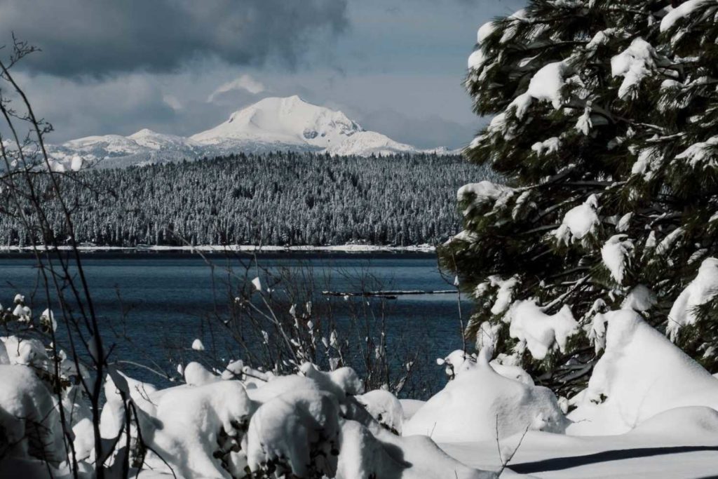 Lake Almanor and snow-covered Lassen Peak in distance during winter