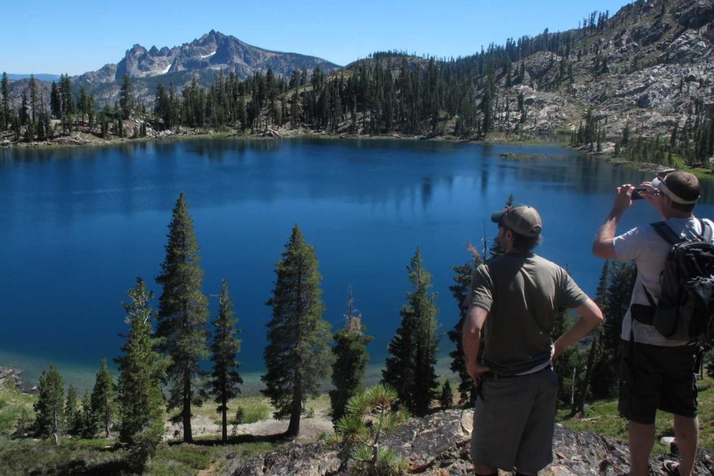 two hikers looking out at deer lake in northern california