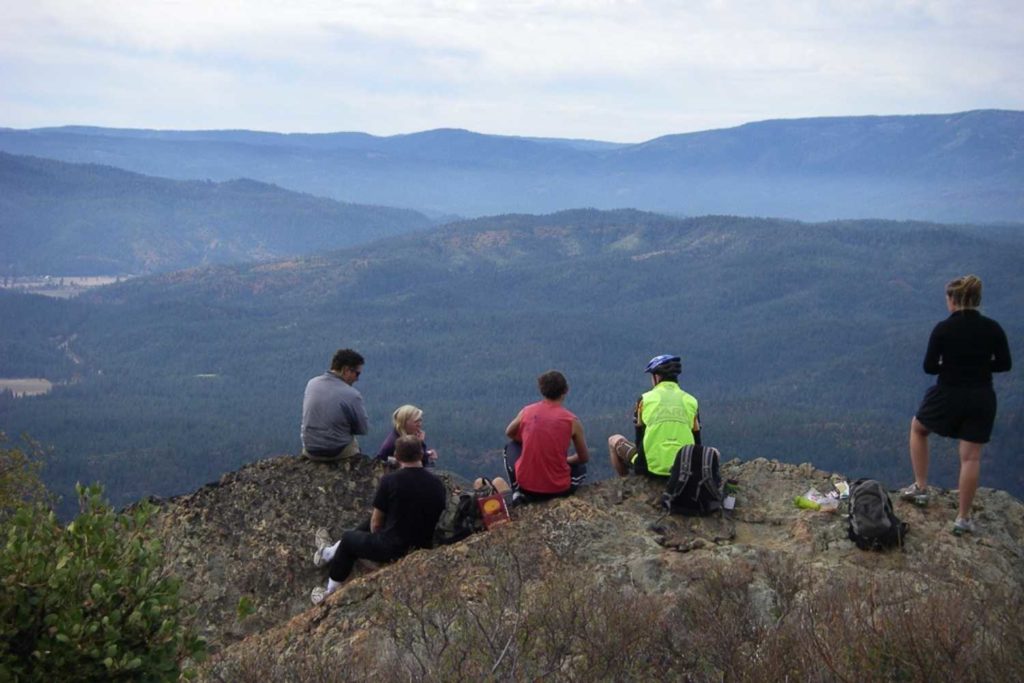 group of hikers looking over mountains in northern california