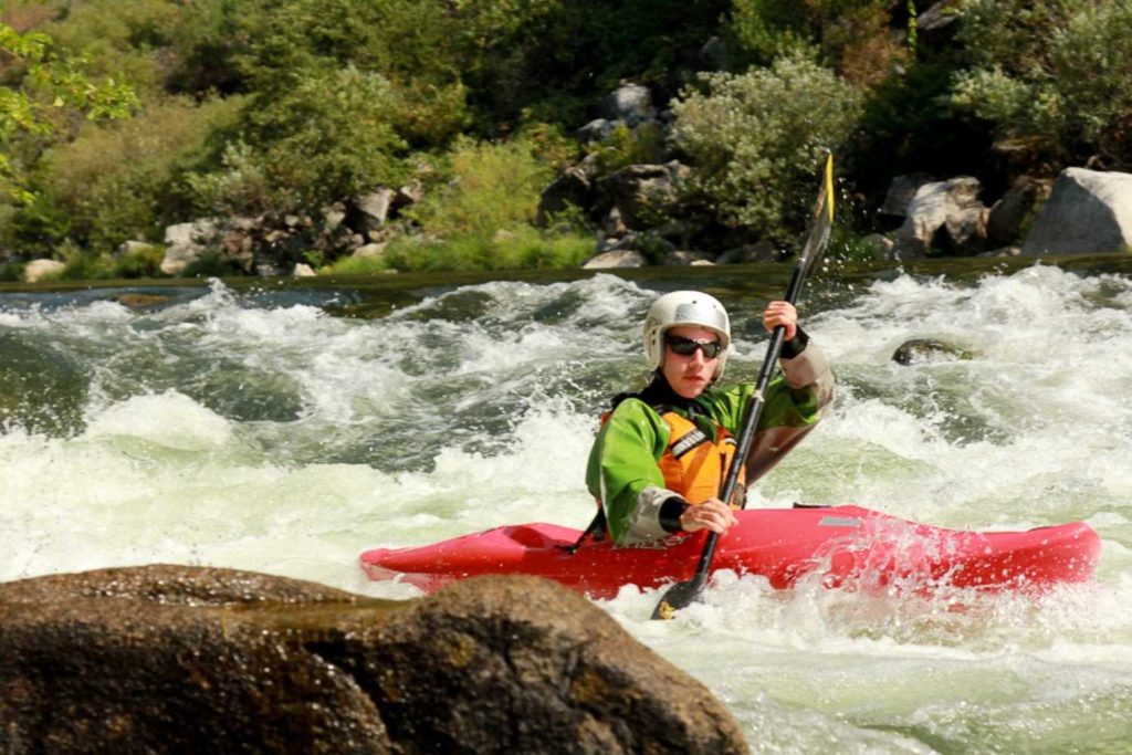 kayaker in whitewater on feather river in plumas county in northern california