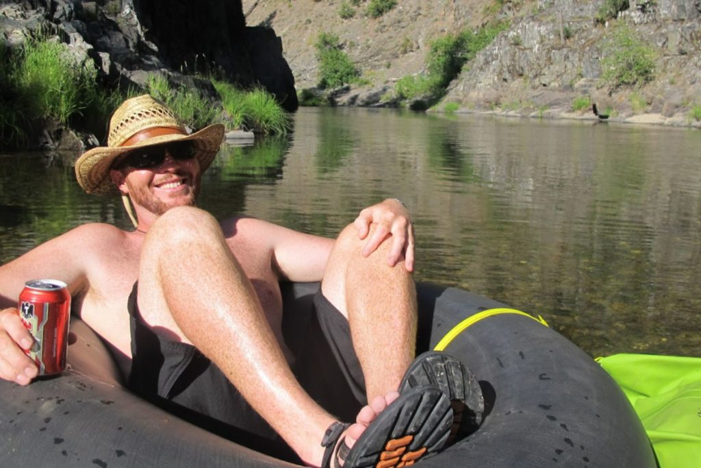 man tubing on the middle fork feather river in northern california