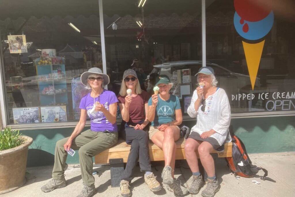 group of ladies enjoying ice cream in front of toy store