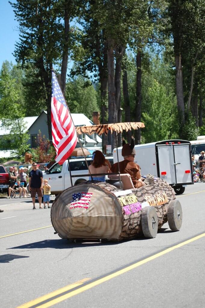 Barney Car flying American Flag in the Chester 4th of July Parade