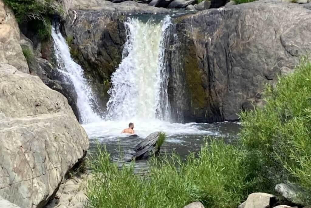 Man in water below Indian Falls Located South of Greeville