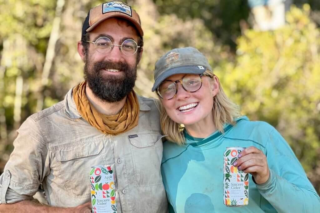 PCT hikers with smiles enjoying sincere cider at farmer's market in Chester