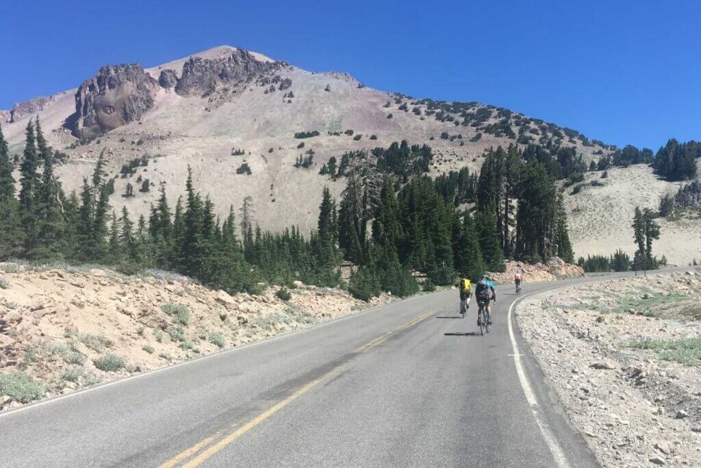 Cyclists ride the highway in Lassen Volcanic National Park