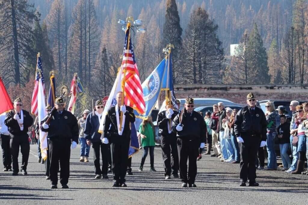 Veterans Day Parade Greenville Ca, Group flying flags and walking