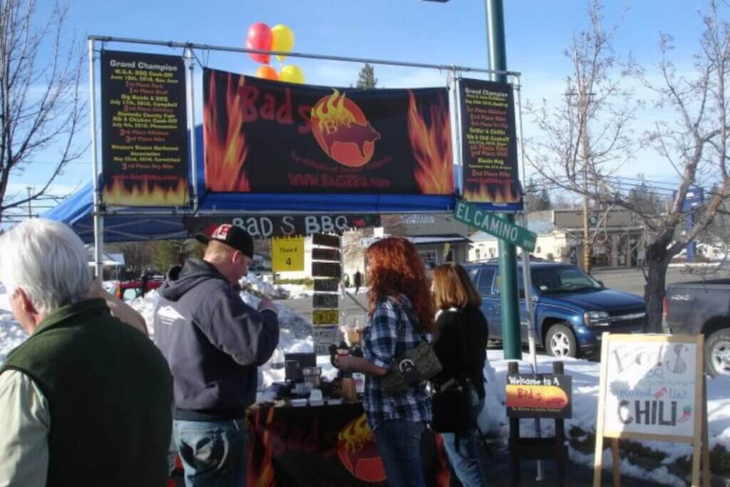 Group in front of a Chili booth