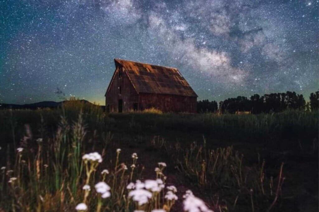The Olsen Barn meadow and a starry sky in Chester, CA