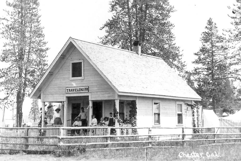 Travelers Inn with customers on porch