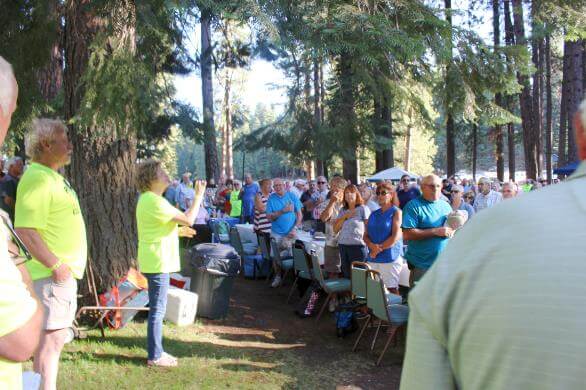Almanor Fishing Association Family BBq. Group of people standing for pledge of alliance