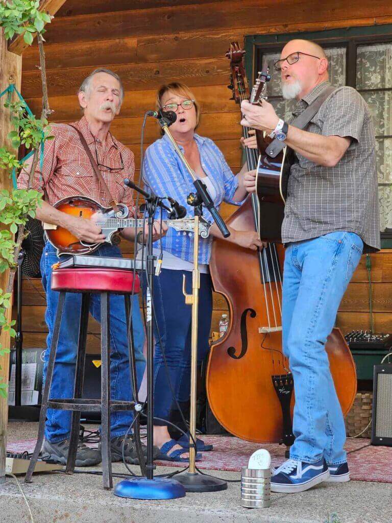 Musicians playing as part of World Wide Play Music on the Porch at Crescent Country