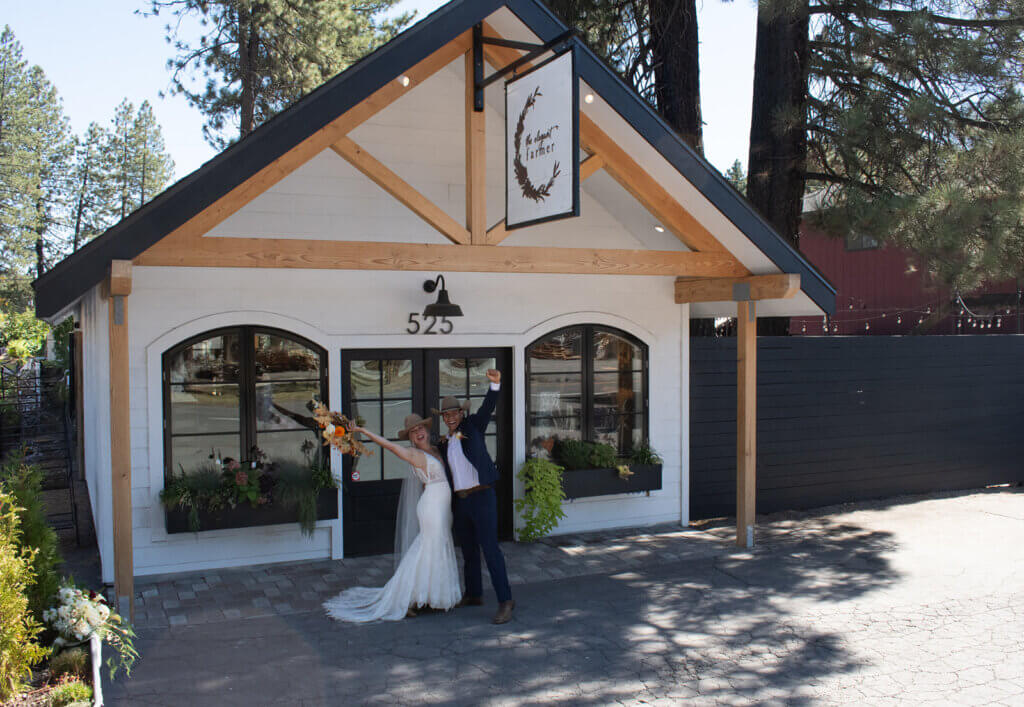 Wedding couple in front of the Elegant Farmer