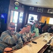 Customoers raising glasses at the Mt. Lassen Club