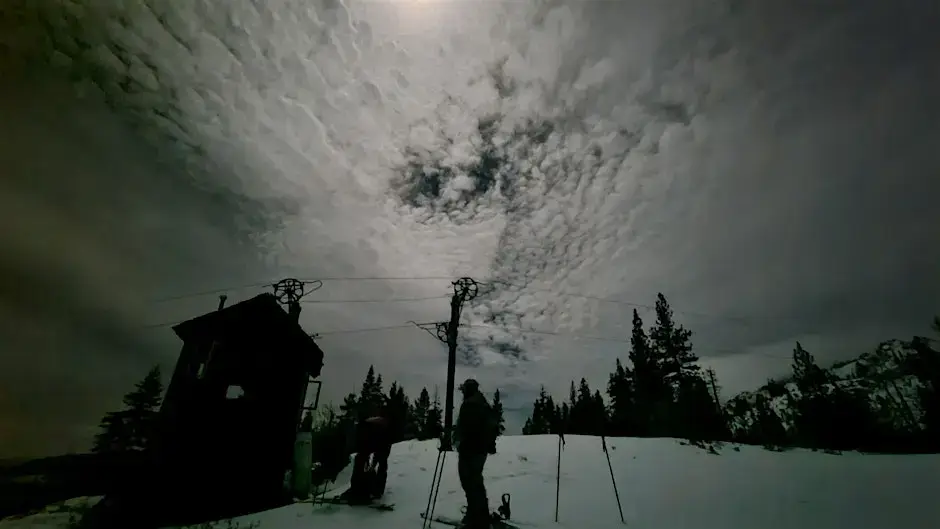 Evening image of skier near the rope tow